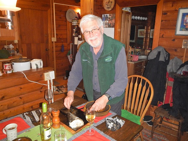 2017 John prepares a fish for dinner on Galiano Island