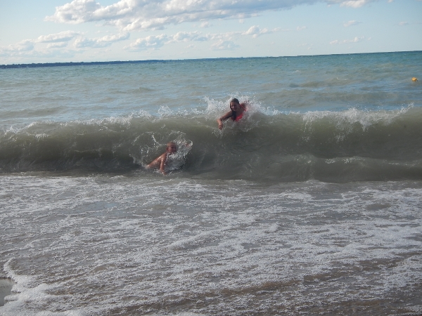 2019 Madi & Barrett ride the waves during a north
            blow
