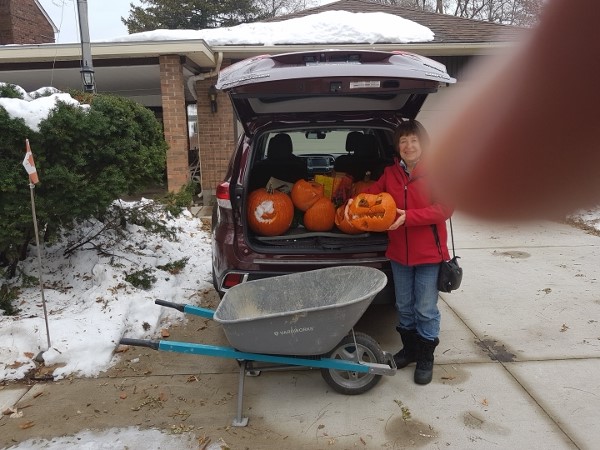2019 Nov 19 Kathy collecting pumpkins for compost