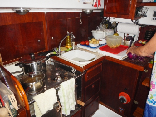 Down below Tundra looking aft to starboard at the galley
        and repositioned sink by the stove