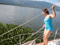 Kathy
                            pushes floating Hyacinth Isand away from
                            Tundra