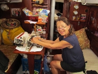 Kathy mans our Tent Maker sewing machine before it
            packed itself in