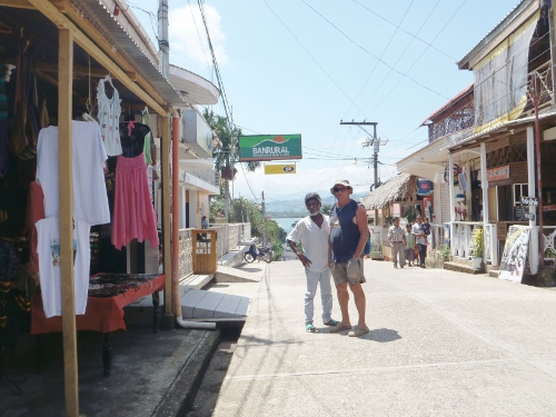 Brian and our dock man pose on the
            main street of Livingston at the mouth of the Rio Dolce
            Guatemala