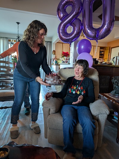 2024 Dec 31 Kathy Celebrates her Belated 80th Birthday
            with Cake
